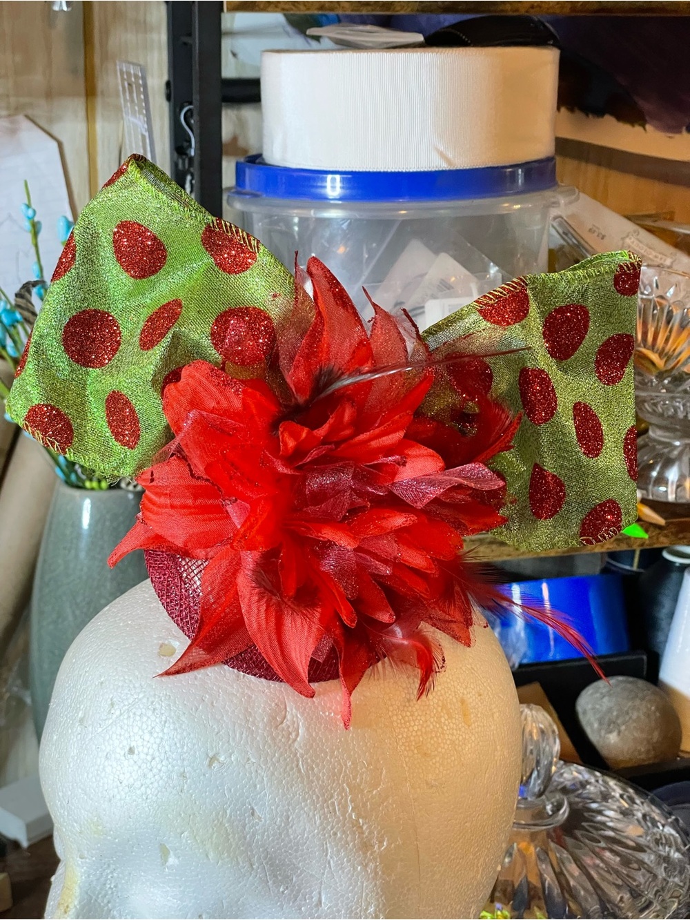 Red Floral Feather Fascinator with Green Polka Dot Bow